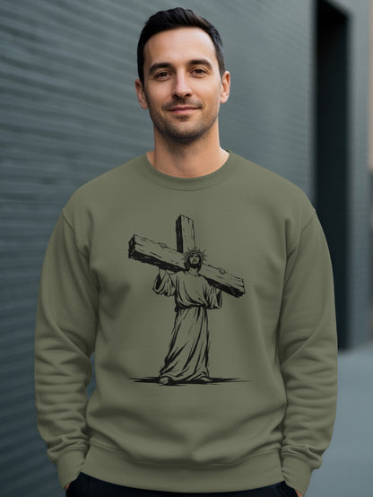 Man wearing olive green sweatshirt with graphic of Jesus carrying a cross.