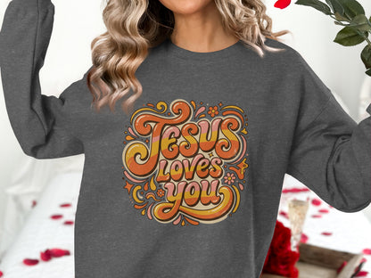 Dark gray sweatshirt with "Jesus Loves You" in retro groovy font.