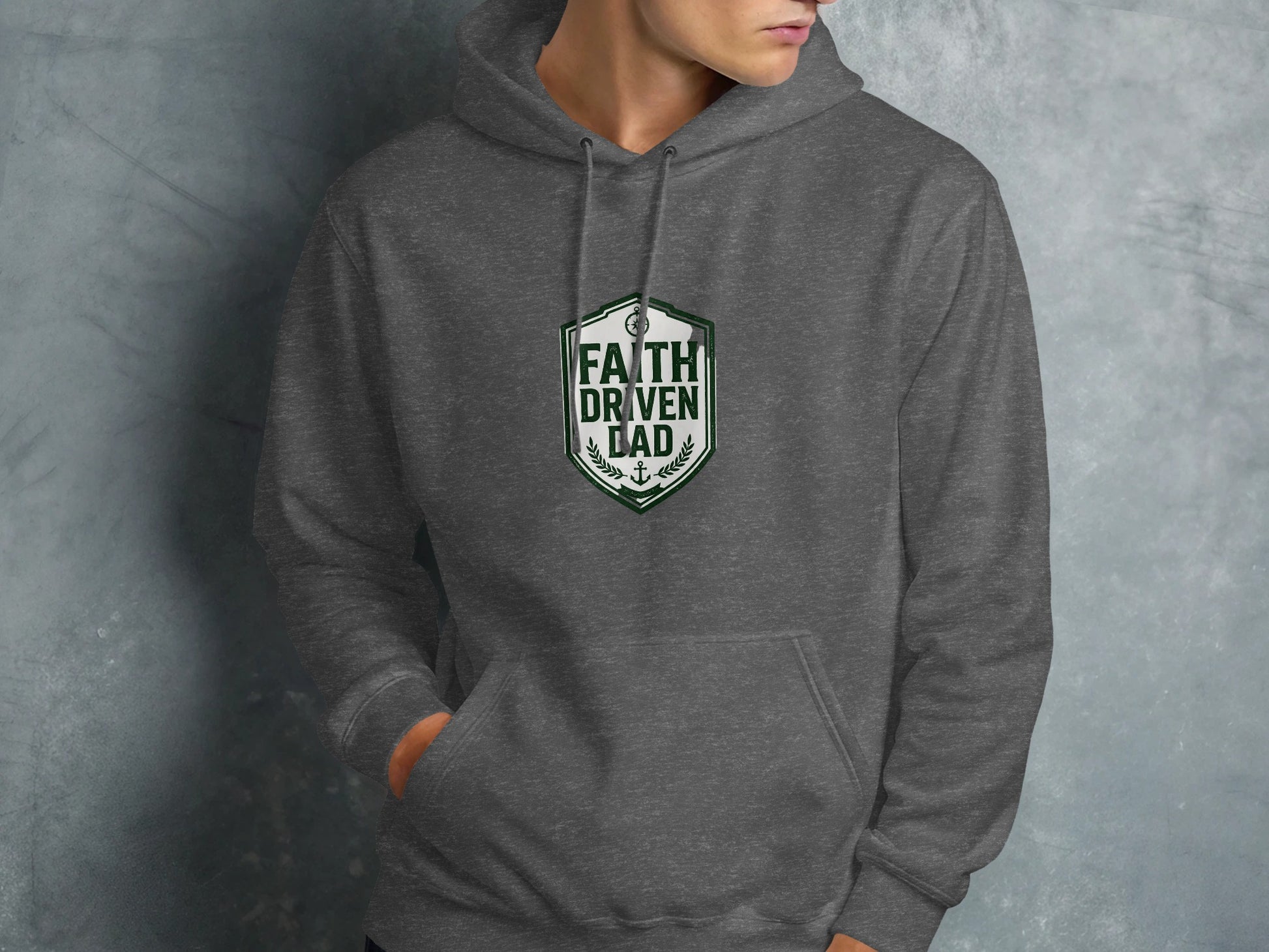 Dark gray hoodie with "FAITH DRIVEN DAD" crest logo on chest.