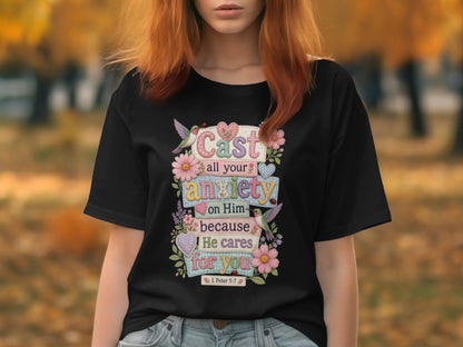 Black t-shirt with floral design and Bible verse "Cast all your anxiety on Him because He cares for you".