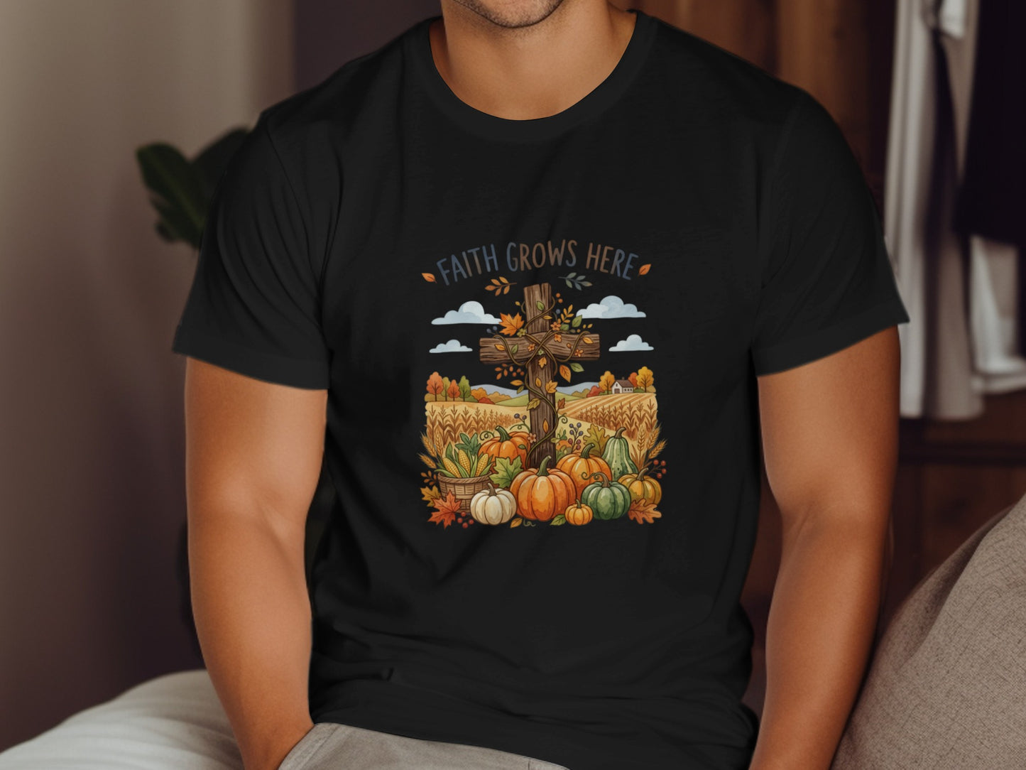 Black t-shirt with a fall harvest scene featuring a cross and pumpkins.