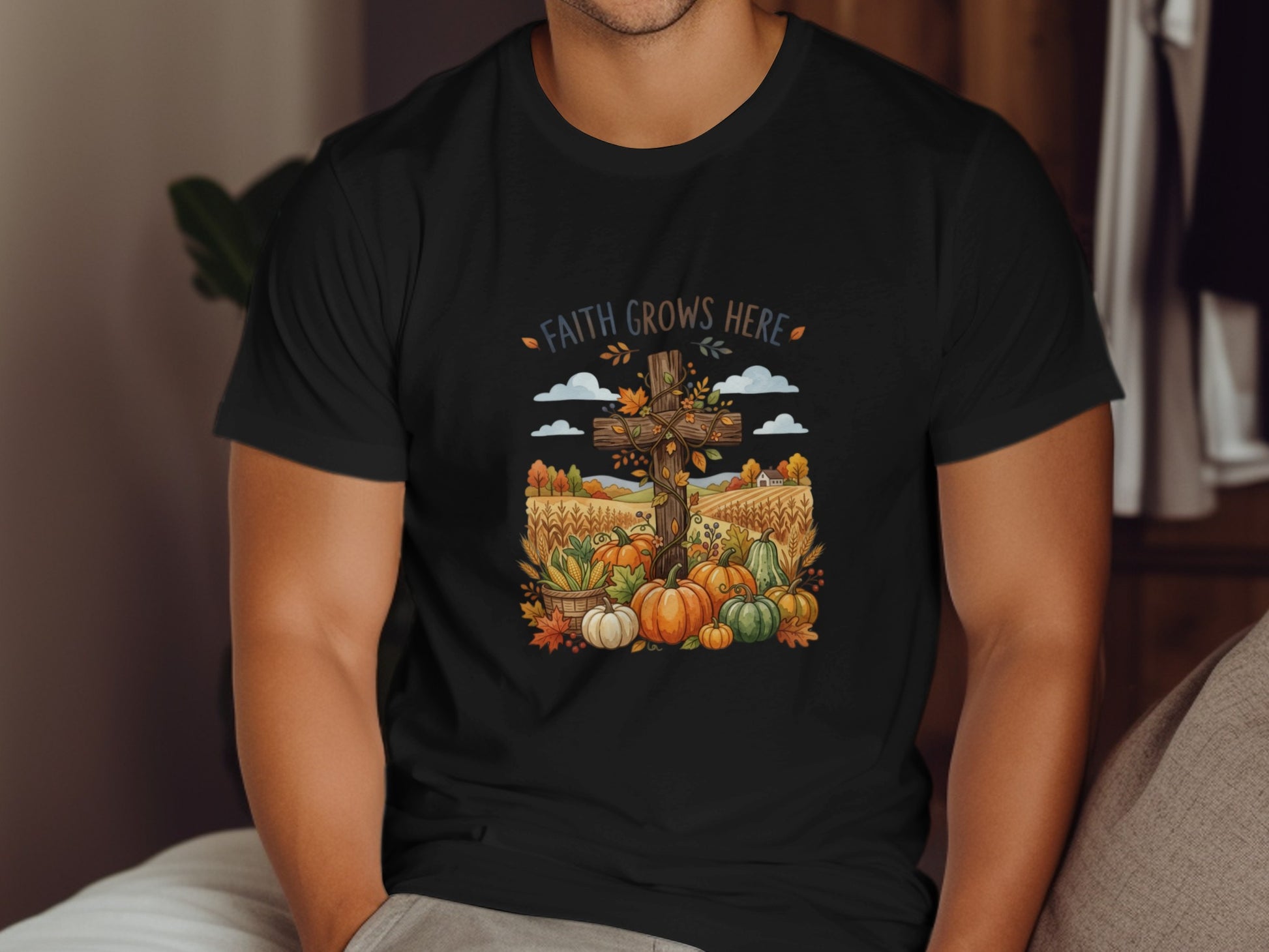 Black t-shirt with a fall harvest scene featuring a cross and pumpkins.