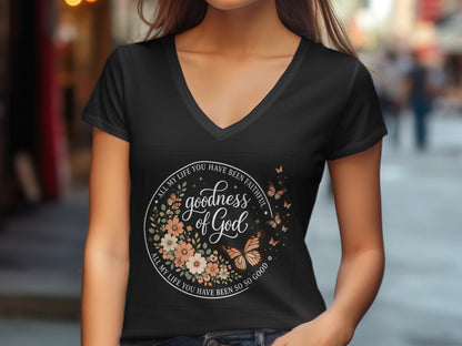 Black t-shirt with circular graphic of flowers, butterflies, and text.