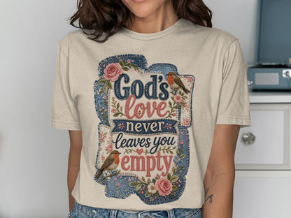 T-shirt with "God's love never leaves you empty" in floral and denim patches.