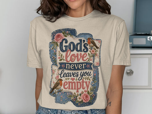 T-shirt with "God's love never leaves you empty" in floral and denim patches.