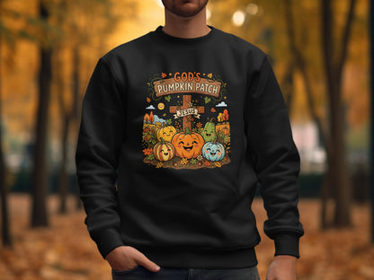 Black sweatshirt with "God's Pumpkin Patch Jesus" and smiling pumpkins graphic.