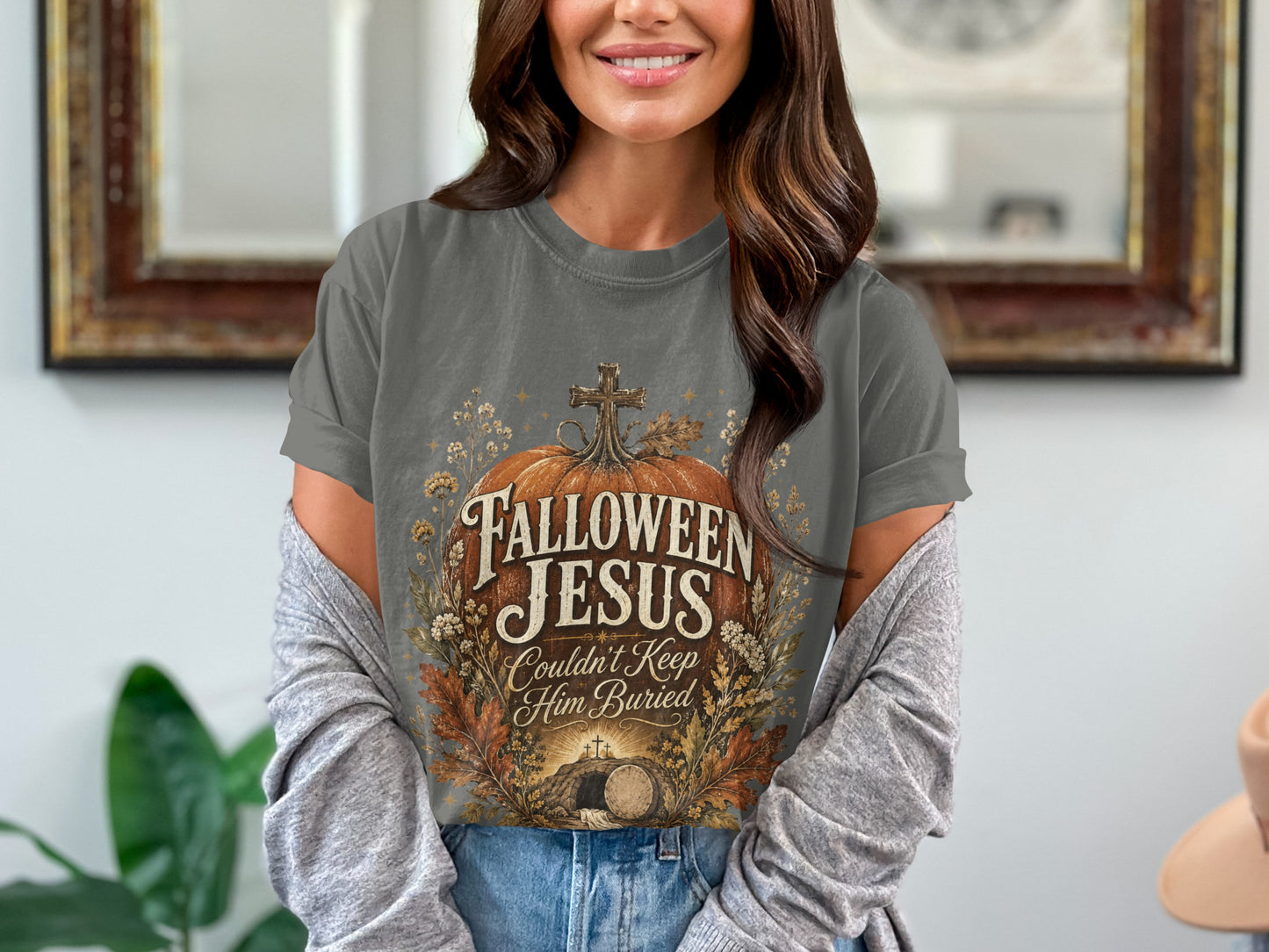Gray t-shirt with "Fallown Jesus Couldn't Keep Him Buried" text and tomb graphic.
