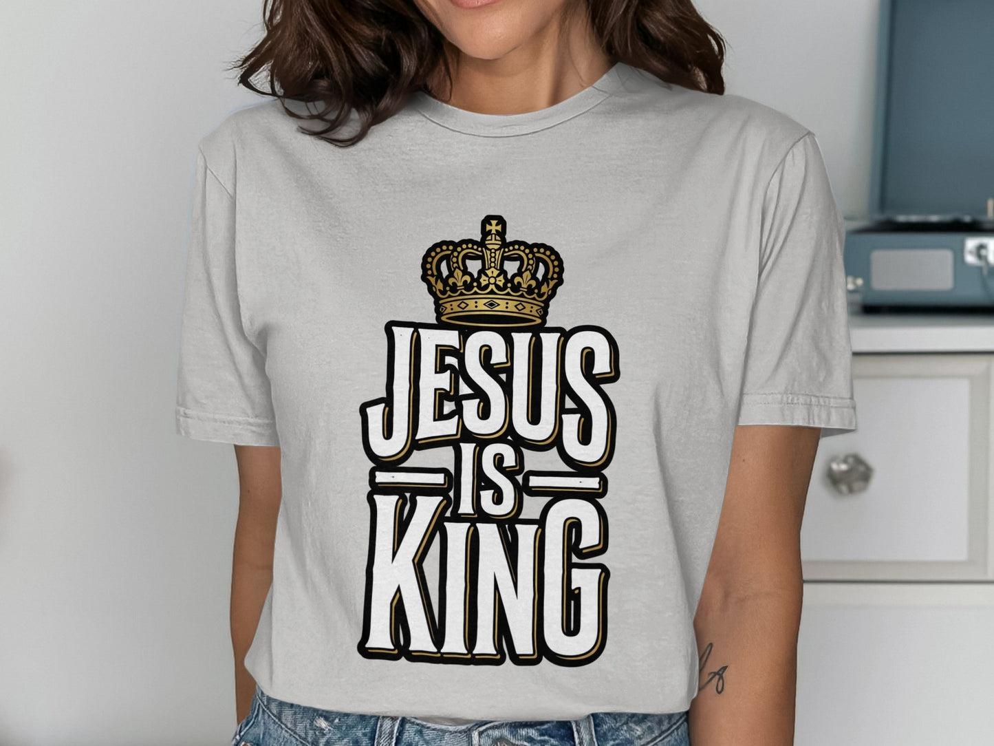 Grey t-shirt with "Jesus is King" text and a crown.