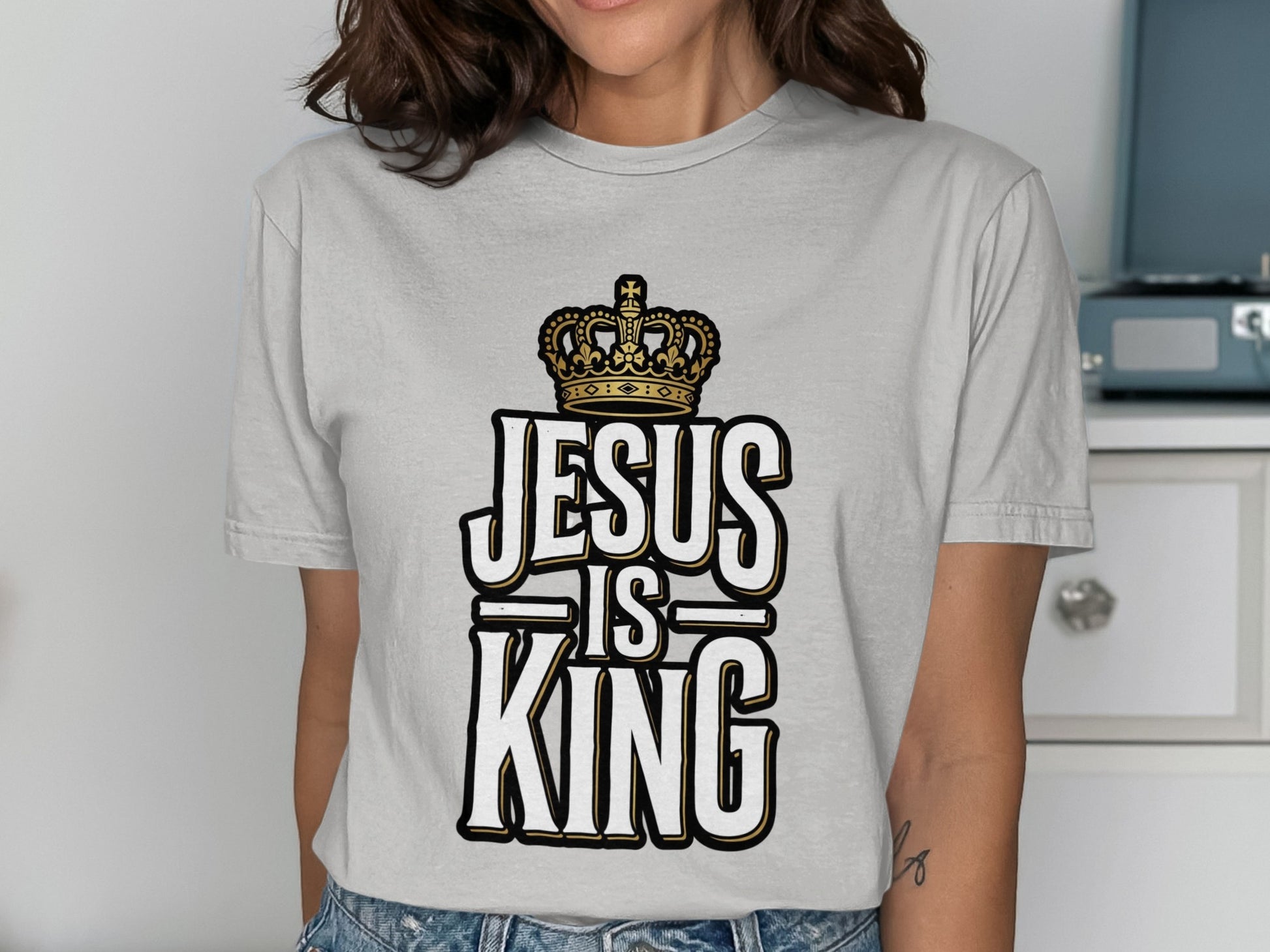 Grey t-shirt with "Jesus is King" text and a crown.