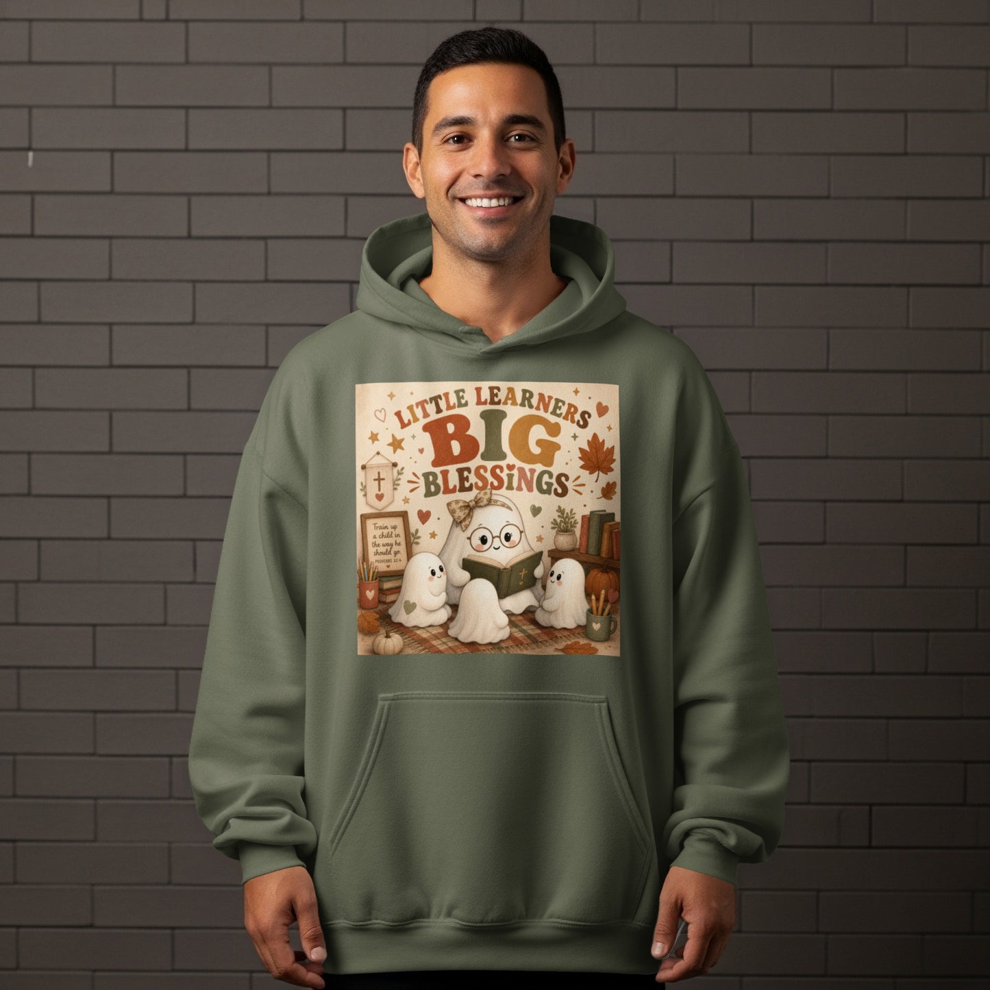 Green hoodie with graphic of ghosts reading and text "Little Learners Big Blessings".