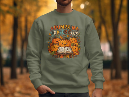 Crewneck sweatshirt with "Pumpkin Prayer Club" text and pumpkins on a Bible.