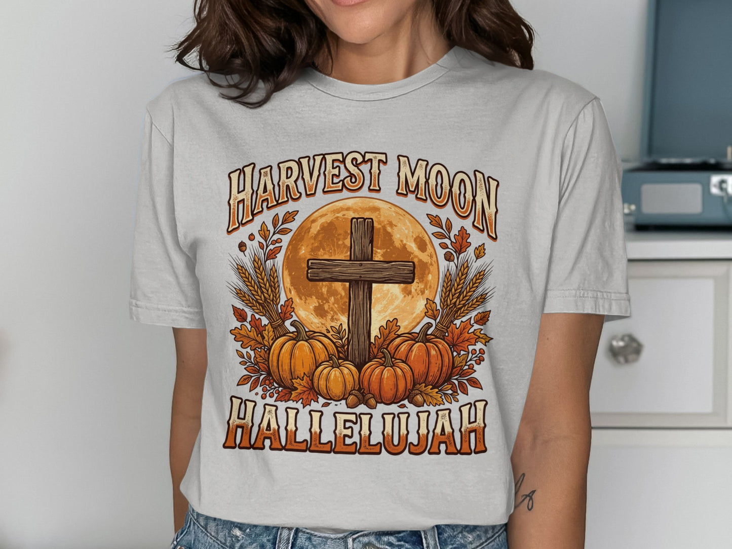 Harvest Moon Hallelujah graphic with cross, pumpkins, and wheat.
