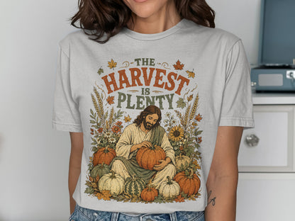 T-shirt with Jesus holding a pumpkin surrounded by harvest elements.