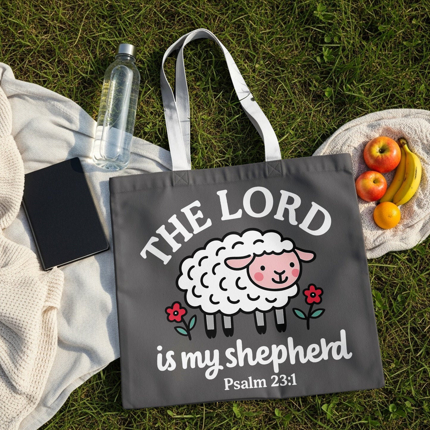 Dark gray tote bag with cartoon sheep, "The Lord is my shepherd Psalm 23:1".