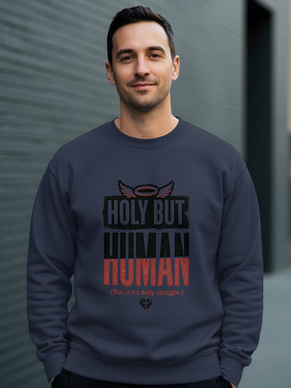 Dark blue sweatshirt with "HOLY BUT HUMAN" text and halo detail.