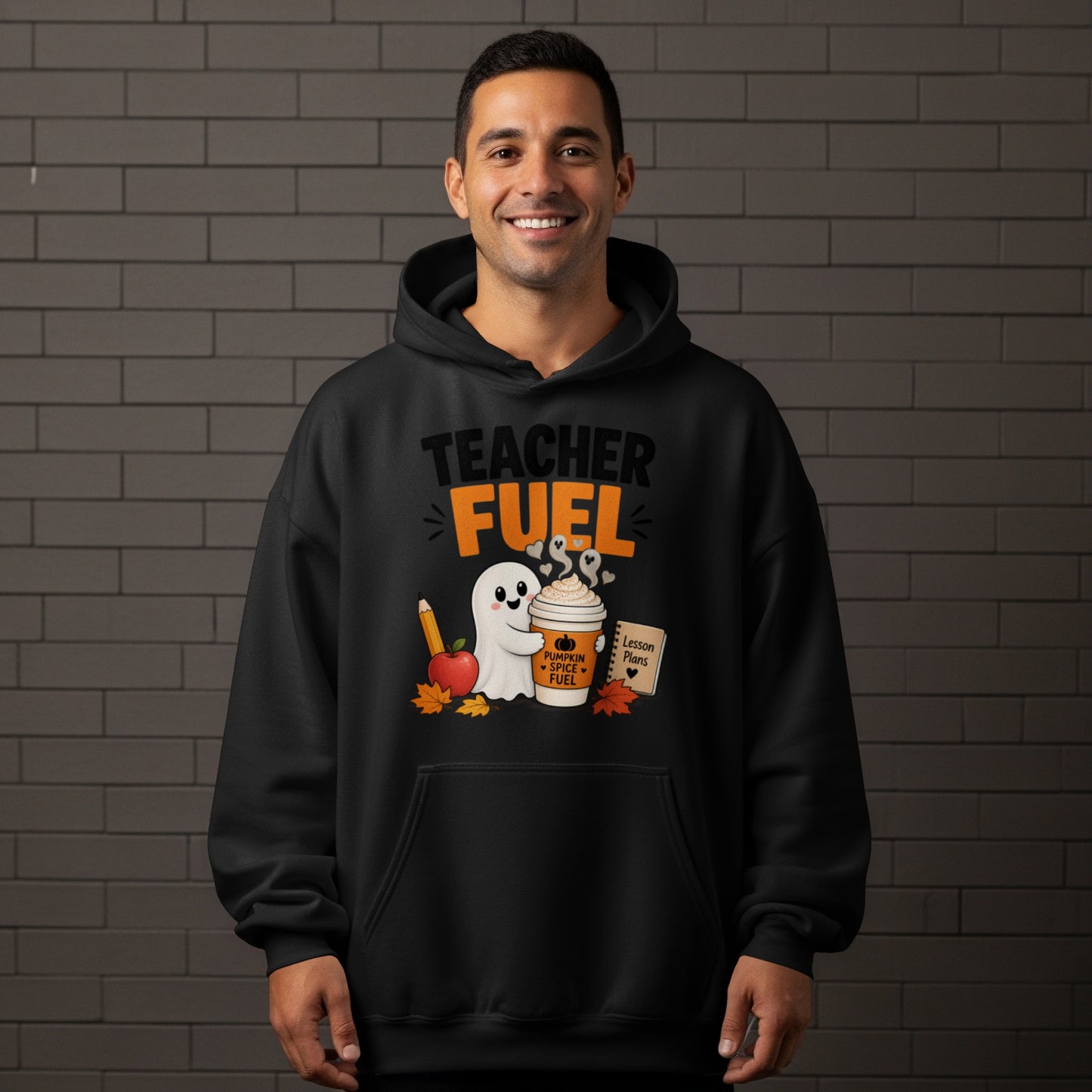 Black hoodie with "Teacher Fuel" text, ghost, coffee cup, and school supplies graphic.
