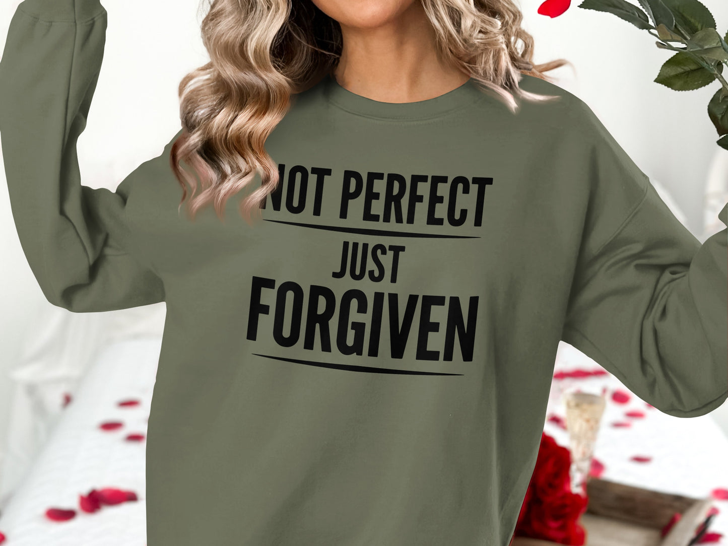 Olive green sweatshirt with "NOT PERFECT JUST FORGIVEN" text.