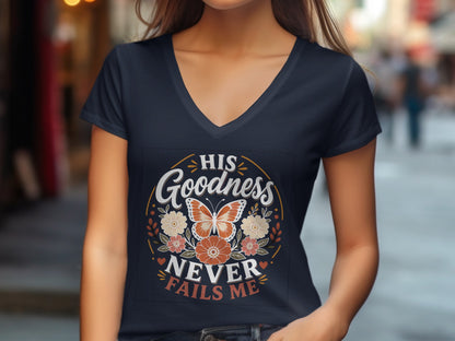 Dark blue v-neck t-shirt with orange floral graphic and text "HIS GOODNESS NEVER FAILS ME".