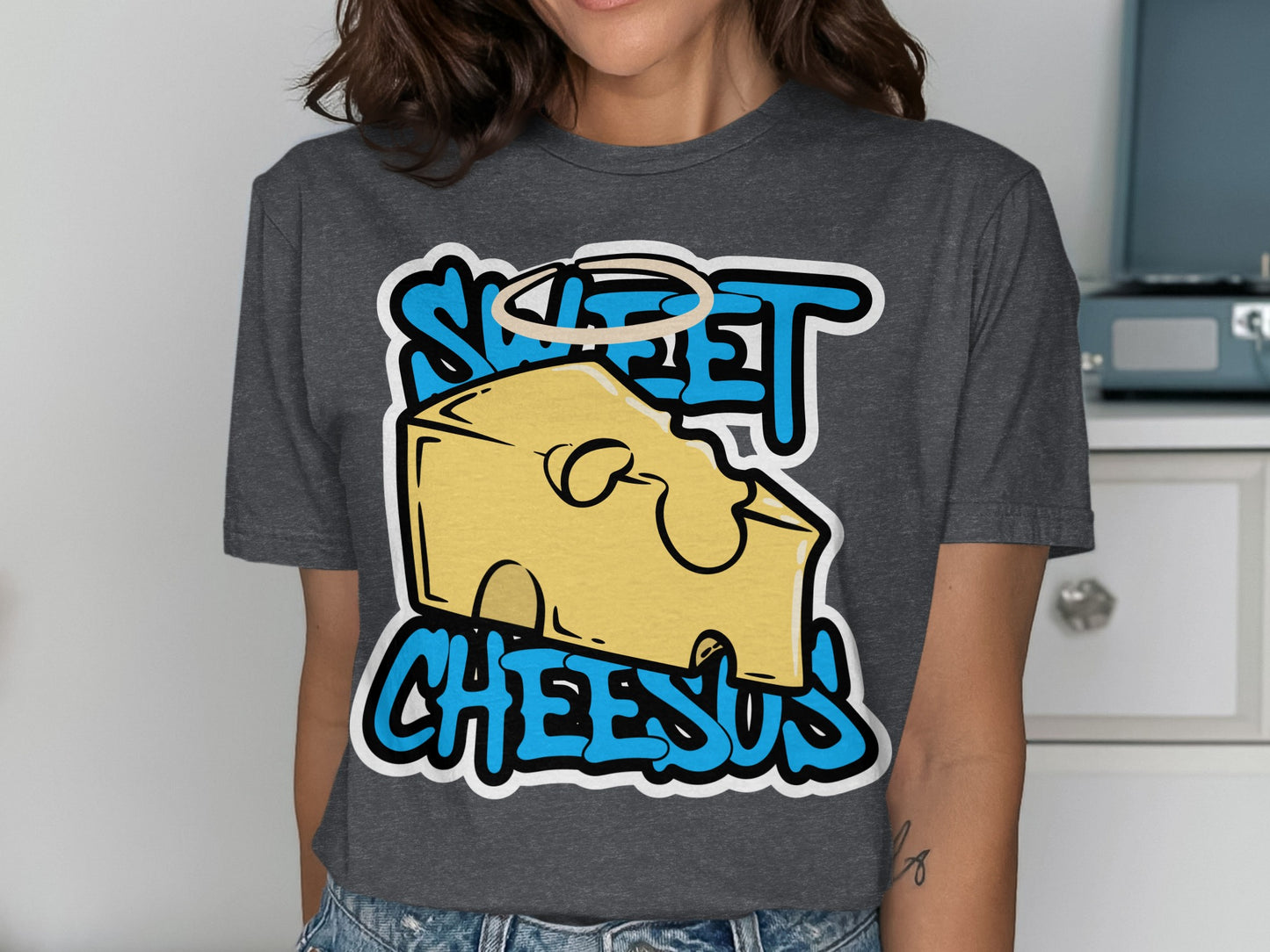 T-shirt with "Sweet Cheesus" text and cartoon cheese with a halo.
