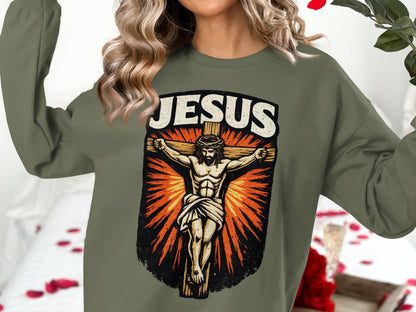 Jesus crucifixion graphic on olive green sweatshirt.