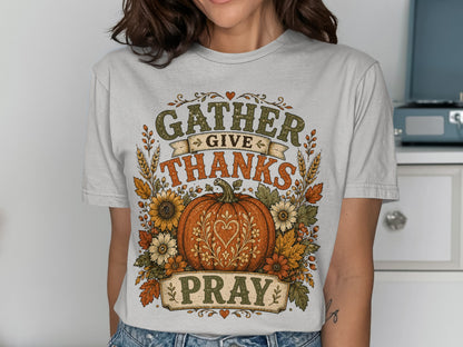 GATHER GIVE THANKS PRAY text on t-shirt with pumpkin and floral wreath.