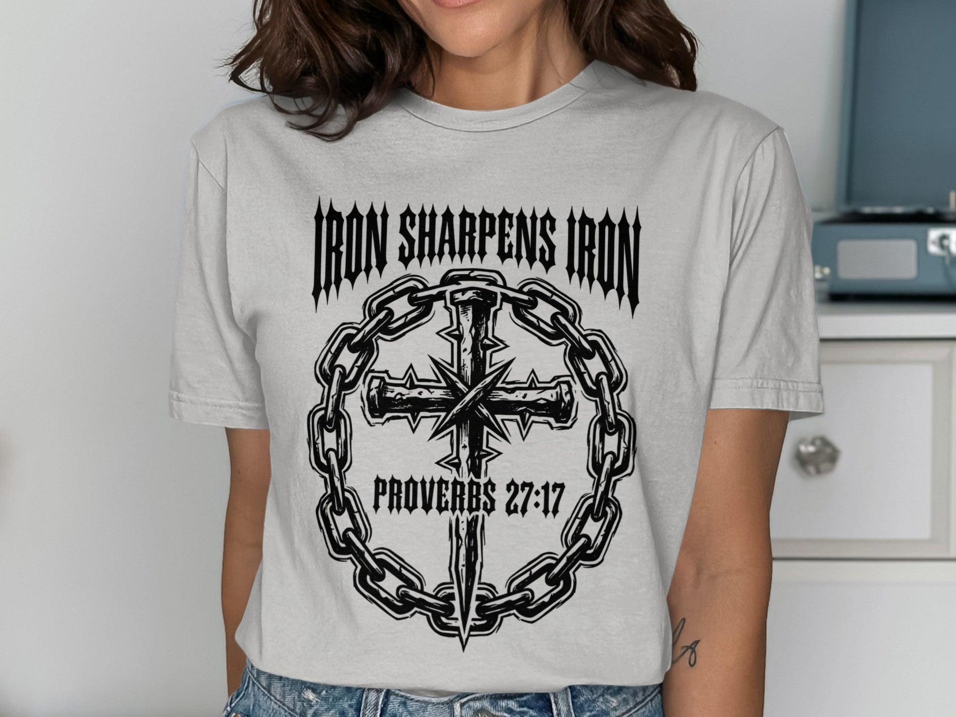 T-shirt with "Iron Sharpens Iron" and a cross within chains, Proverbs 27:17.