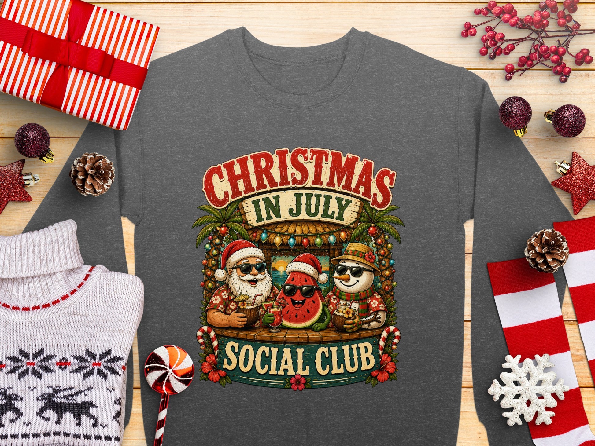 Christmas in July Social Club graphic with Santa watermelon and pineapple characters.