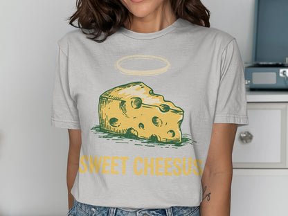 T-shirt with a cartoon slice of Swiss cheese and "Sweet Cheesus" text.