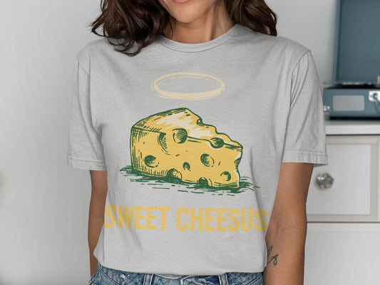 T-shirt with a cartoon slice of Swiss cheese and "Sweet Cheesus" text.