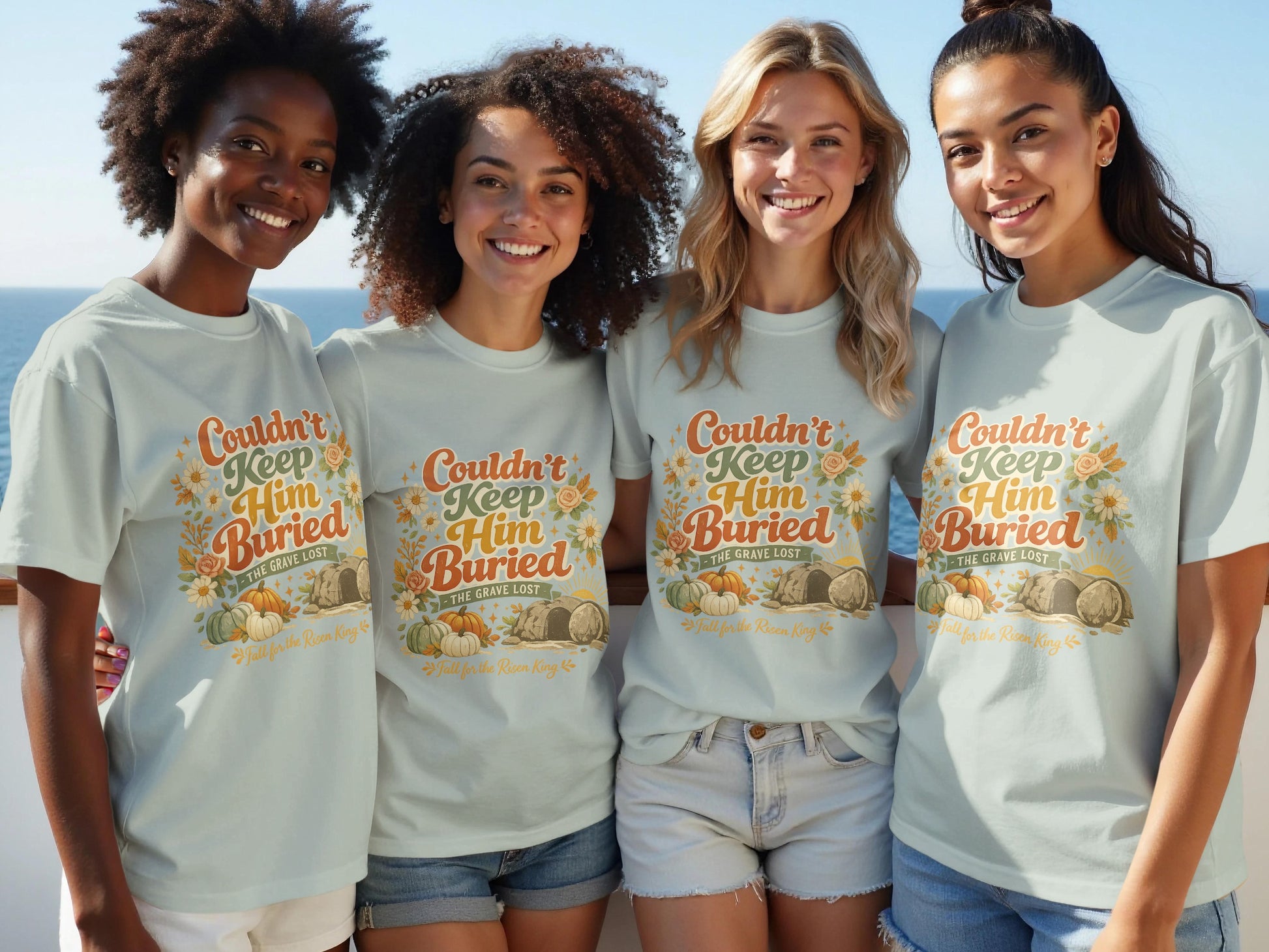 Light blue t-shirt with "Couldn't Keep Him Buried" graphic and pumpkins.