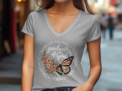 Grey v-neck t-shirt with "goodness of God" and butterfly graphic.