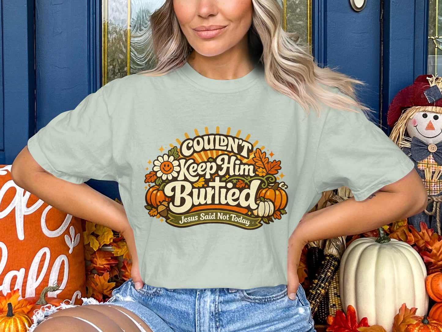 Light green t-shirt with graphic text: Couldn't Keep Him Buried. Jesus Said Not Today.