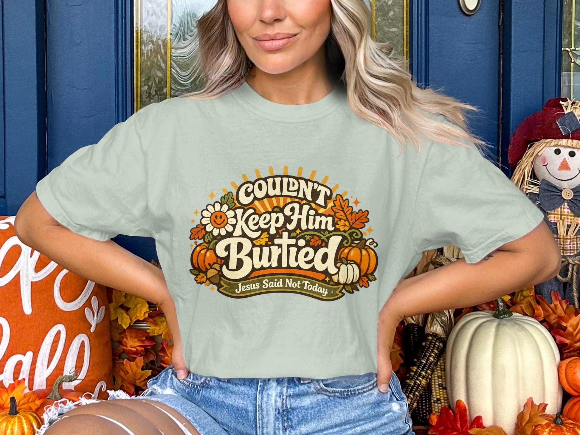 Light green t-shirt with graphic text: Couldn't Keep Him Buried. Jesus Said Not Today.