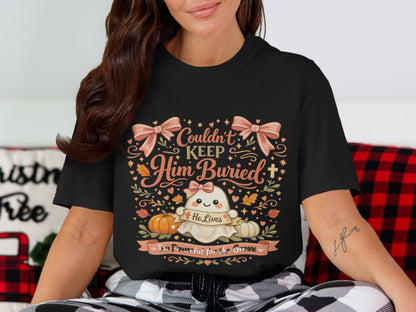 Black t-shirt with a cute ghost, pumpkins, and text saying "Couldn't Keep Him Buried".