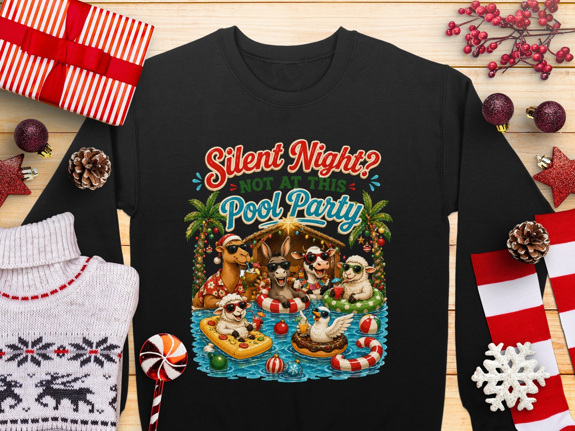 Christmas nativity scene with animals in pool floats, text "Silent Night? Not at this Pool Party."