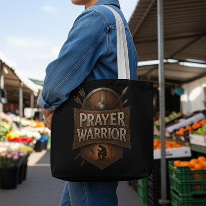Black tote bag with "Prayer Warrior" text and a shield emblem.