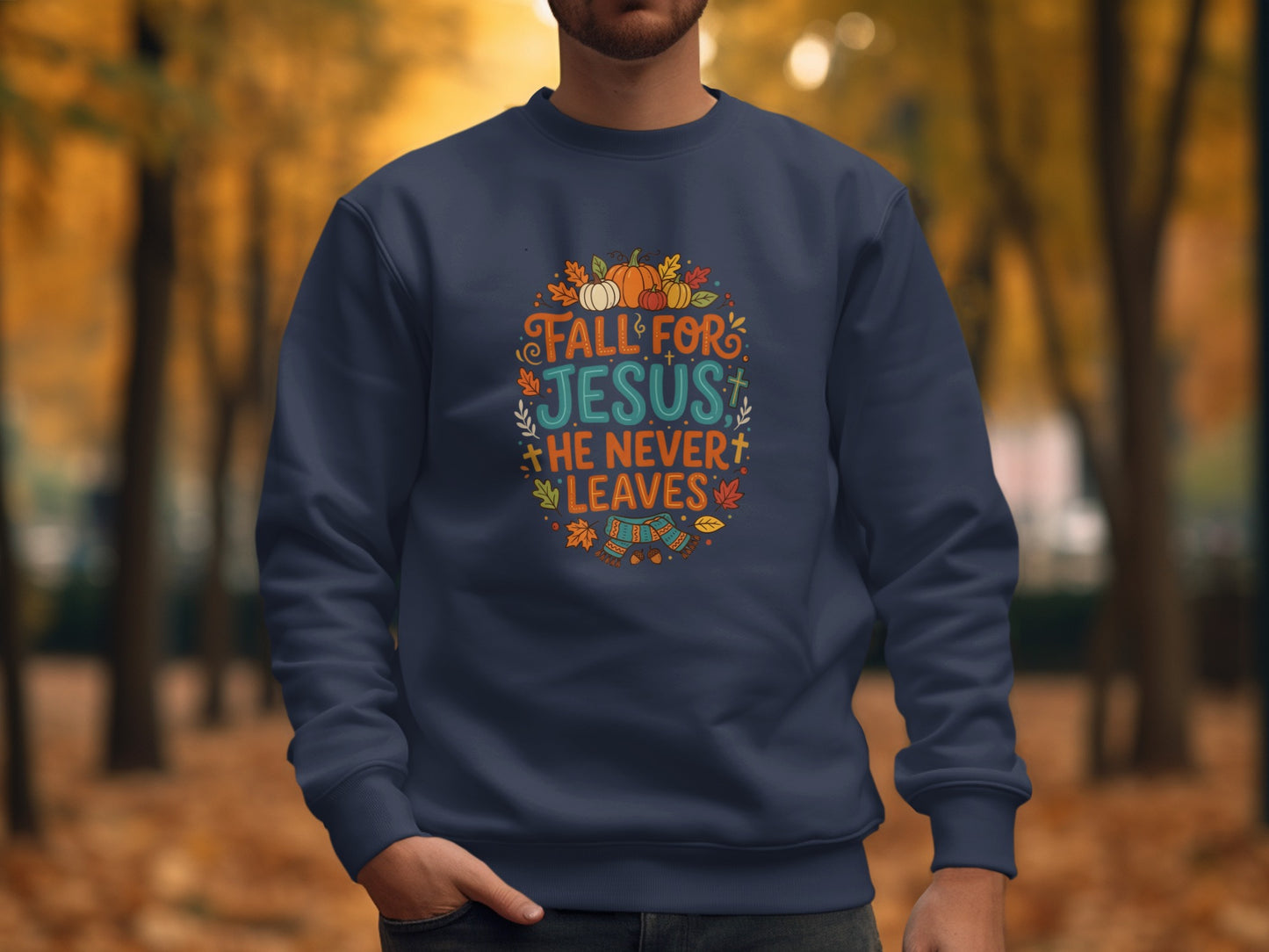 Navy sweatshirt with "Fall for Jesus He Never Leaves" text and fall graphics.