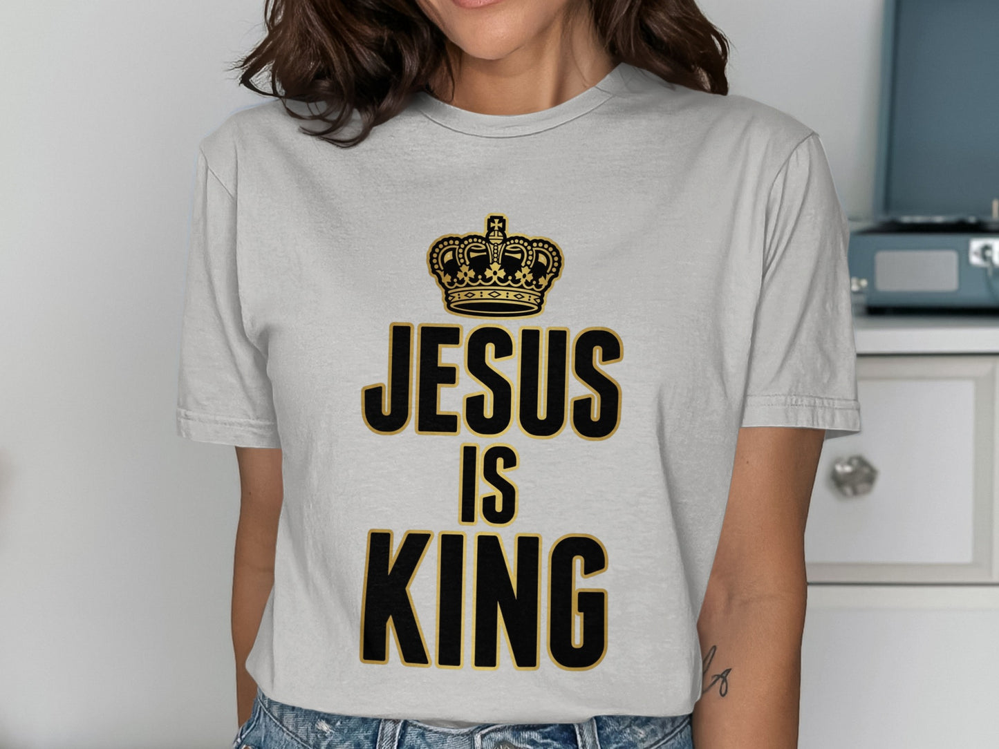 Grey t-shirt with "Jesus is King" text and a crown graphic.