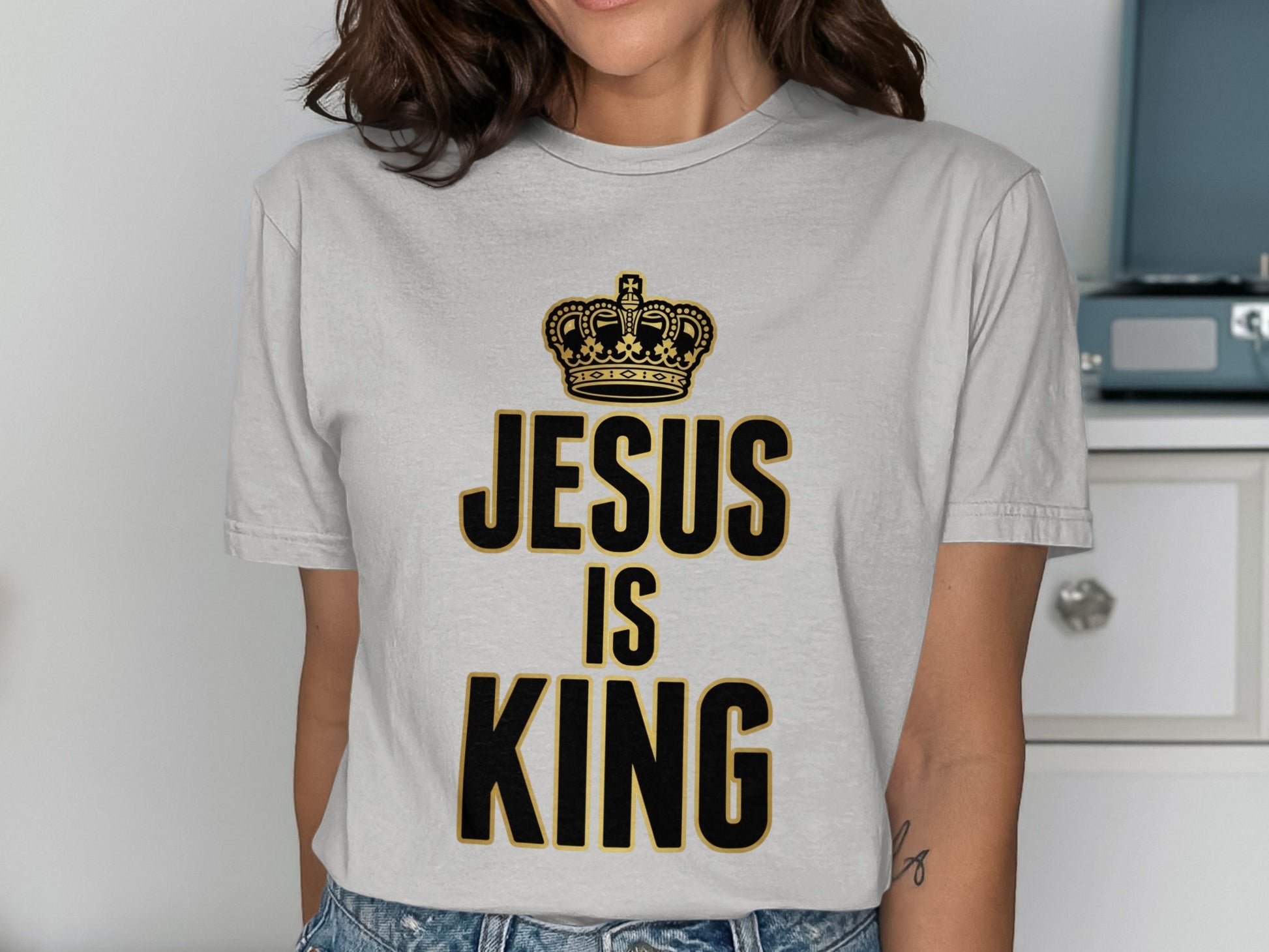 Grey t-shirt with "Jesus is King" text and a crown graphic.