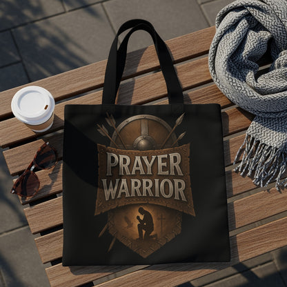 Black tote bag with "Prayer Warrior" text and kneeling silhouette.