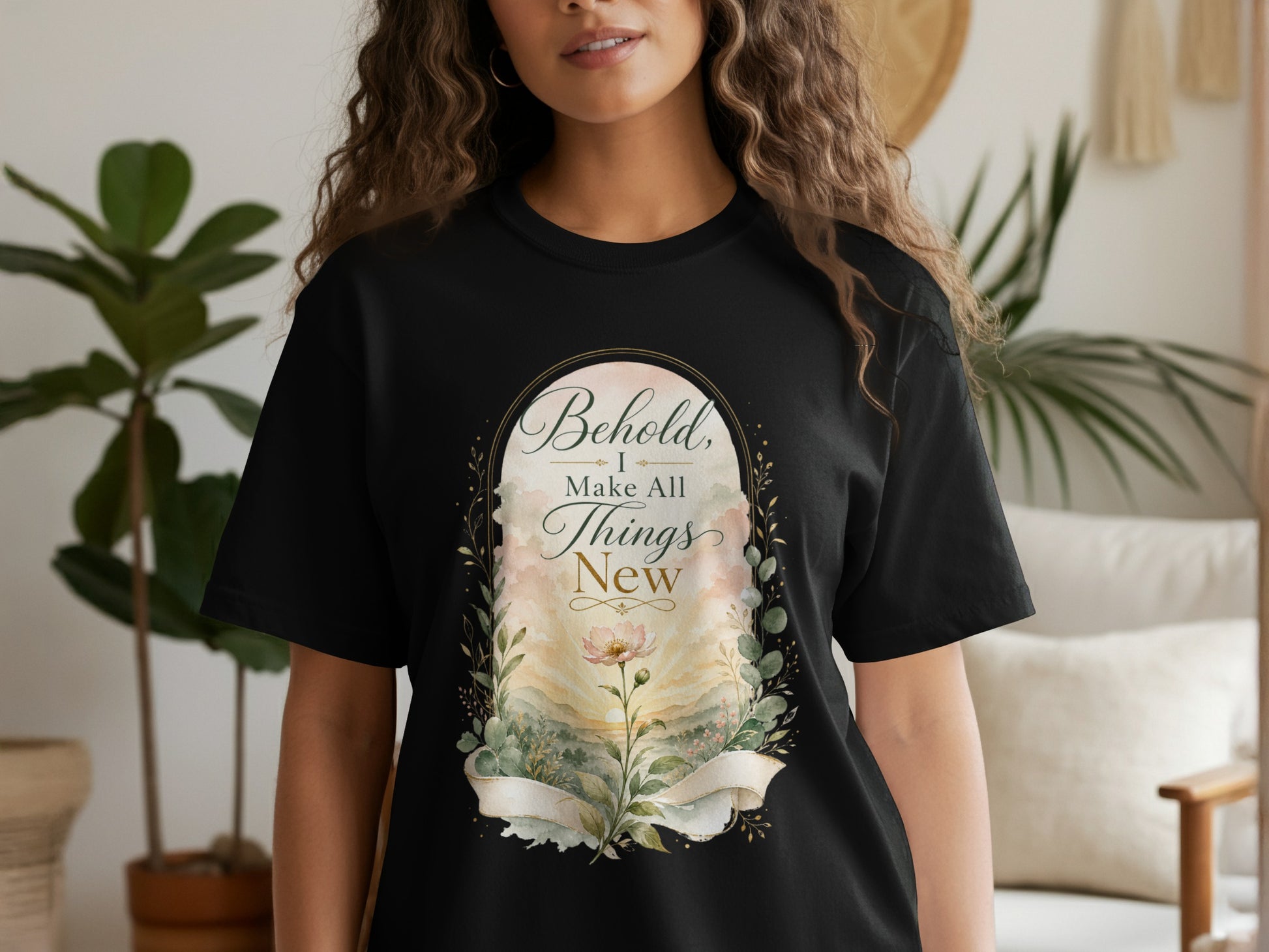 Black t-shirt with "Behold, I Make All Things New" text and floral motif.