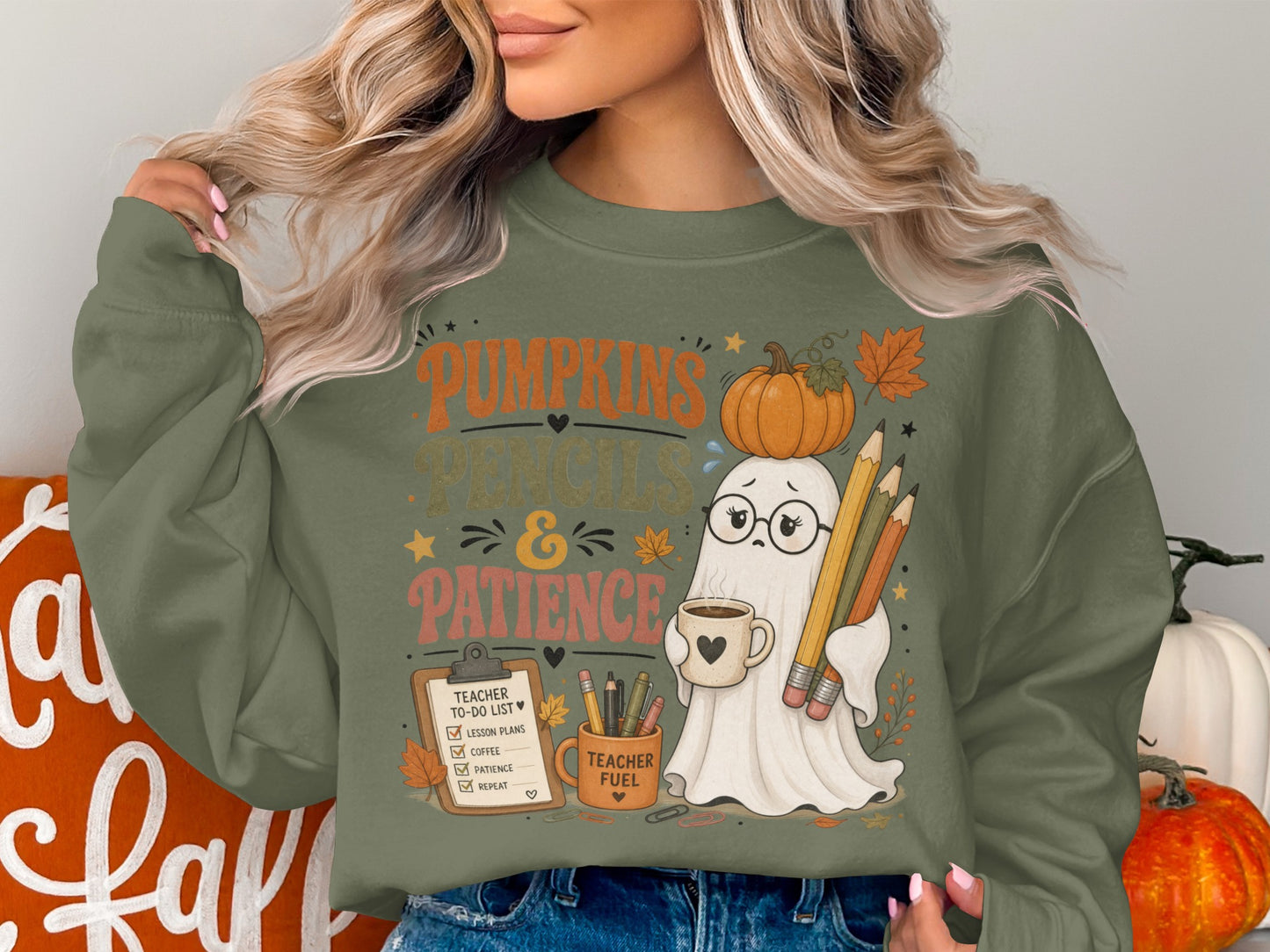 Ghost graphic on green sweatshirt with text "Pumpkins Pencils & Patience" and "Teacher Fuel".
