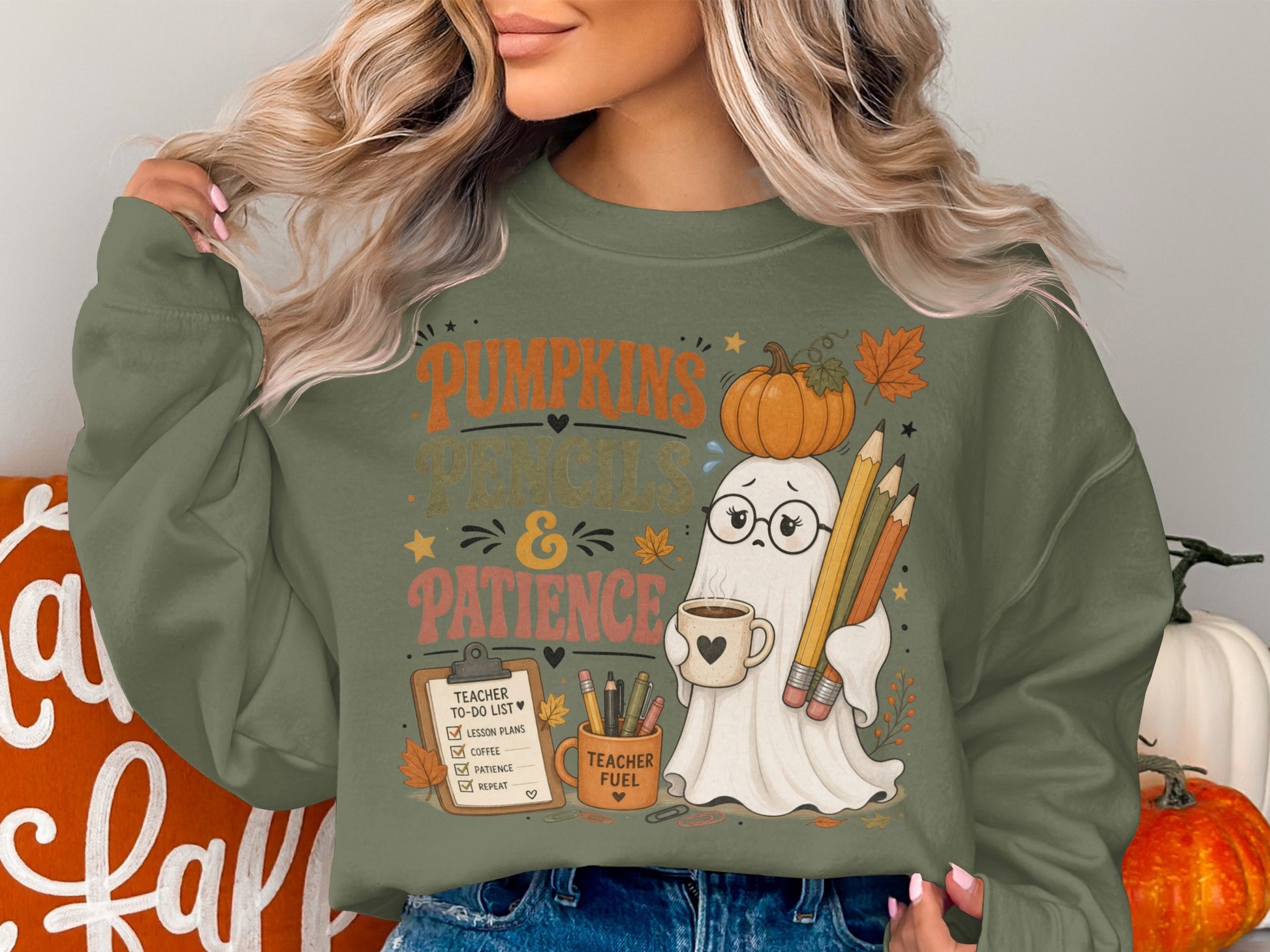 Ghost graphic on green sweatshirt with text "Pumpkins Pencils & Patience" and "Teacher Fuel".