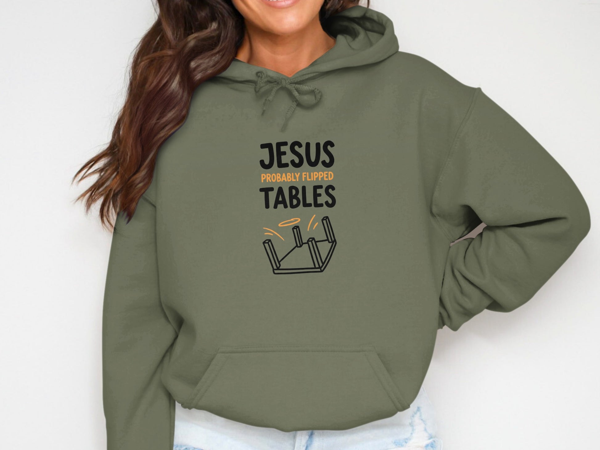 Olive hoodie with text "JESUS PROBABLY FLIPPED TABLES" and illustration.