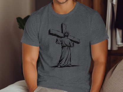 Jesus carrying a large wooden cross, graphic print on a dark gray t-shirt.