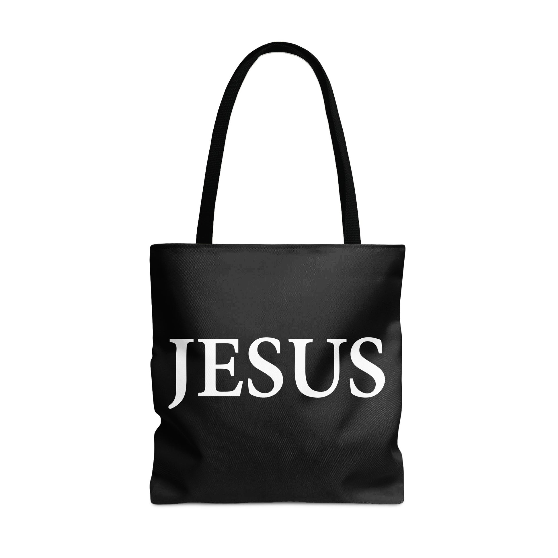 Black tote bag with white "JESUS" text and black handles.