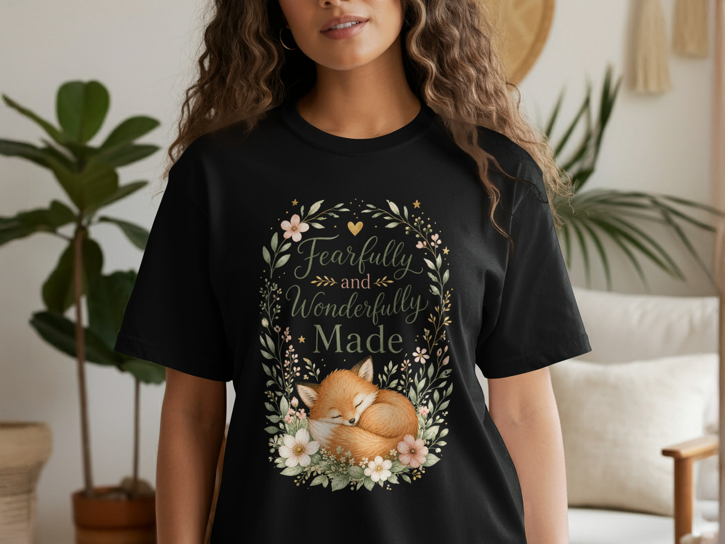 Black t-shirt with floral wreath and sleeping fox, text "Fearfully and Wonderfully Made".