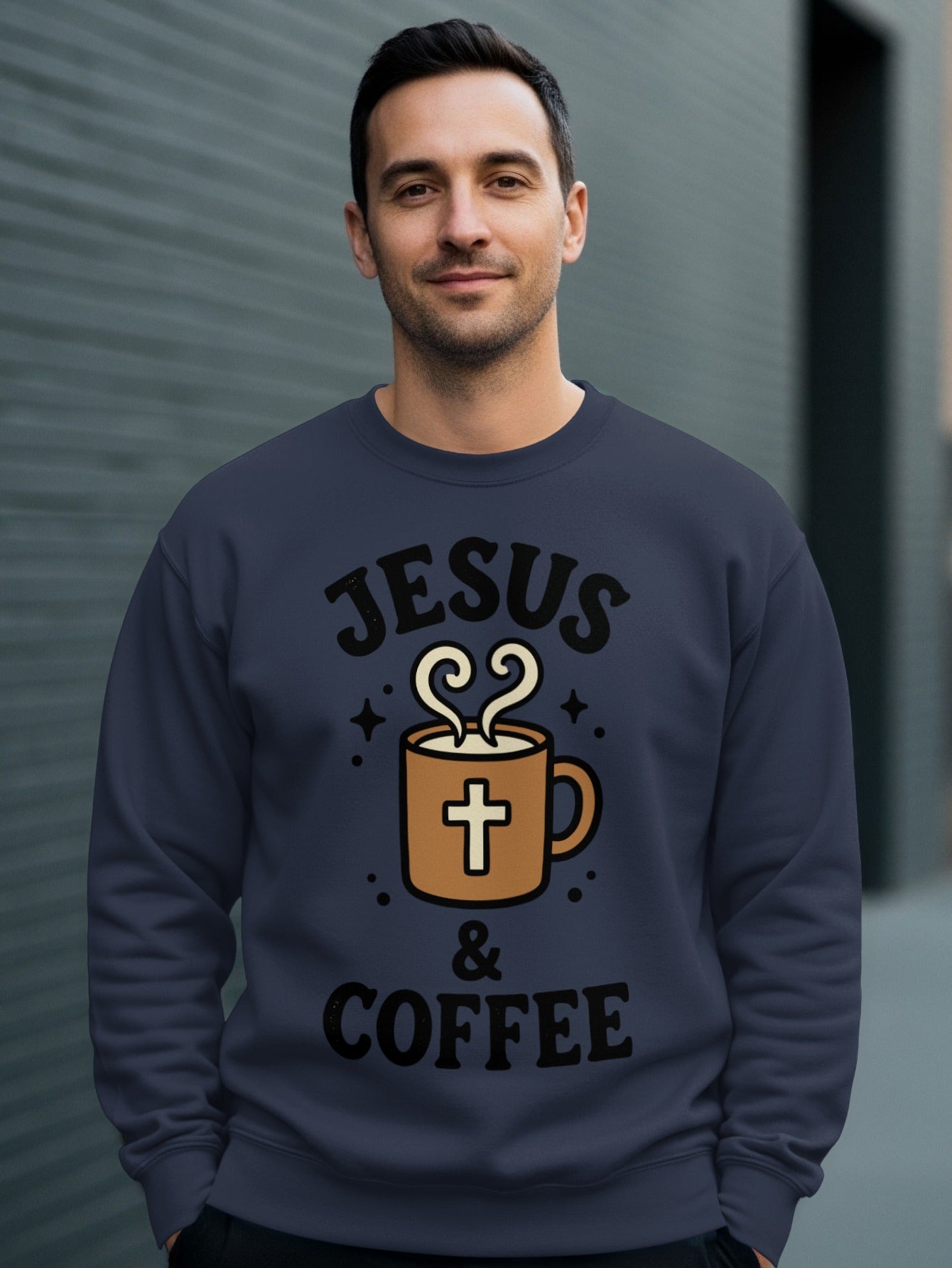 Man wearing navy sweatshirt with "Jesus & Coffee" graphic featuring a coffee cup and cross.
