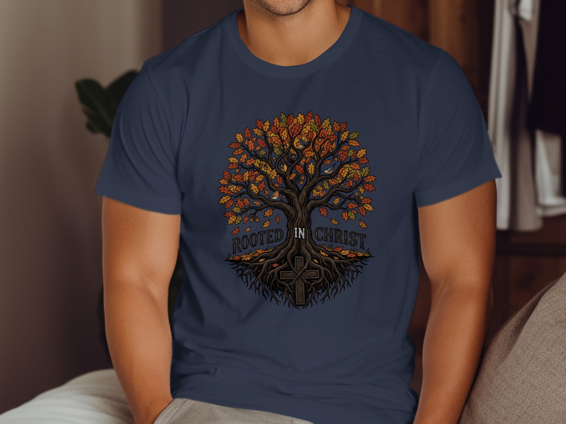 Navy t-shirt with a colorful tree of life and a cross on the roots.