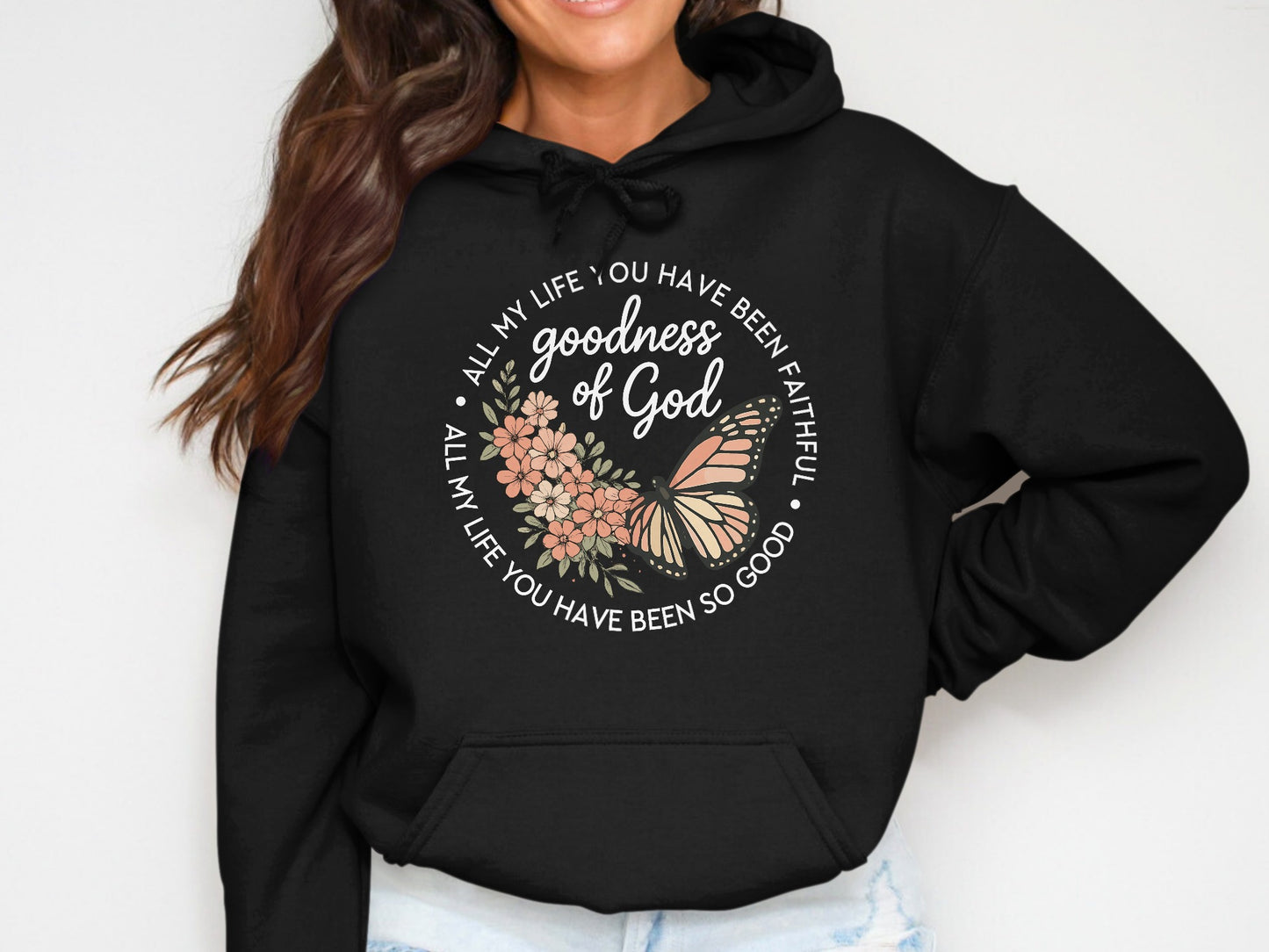 Black hoodie with floral and butterfly graphic and text "All my life you have been faithful goodness of God".